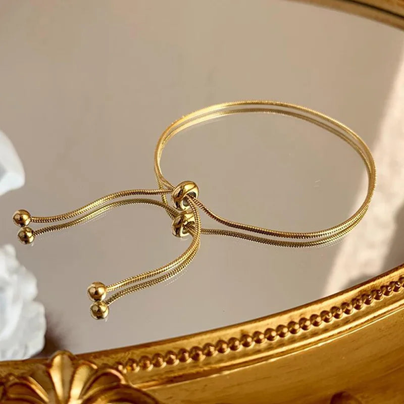 Anenjery 316l aço inoxidável ajustável puxar pulseira tornozeleira feminina ins vento frio simples cobra osso corrente pulseira